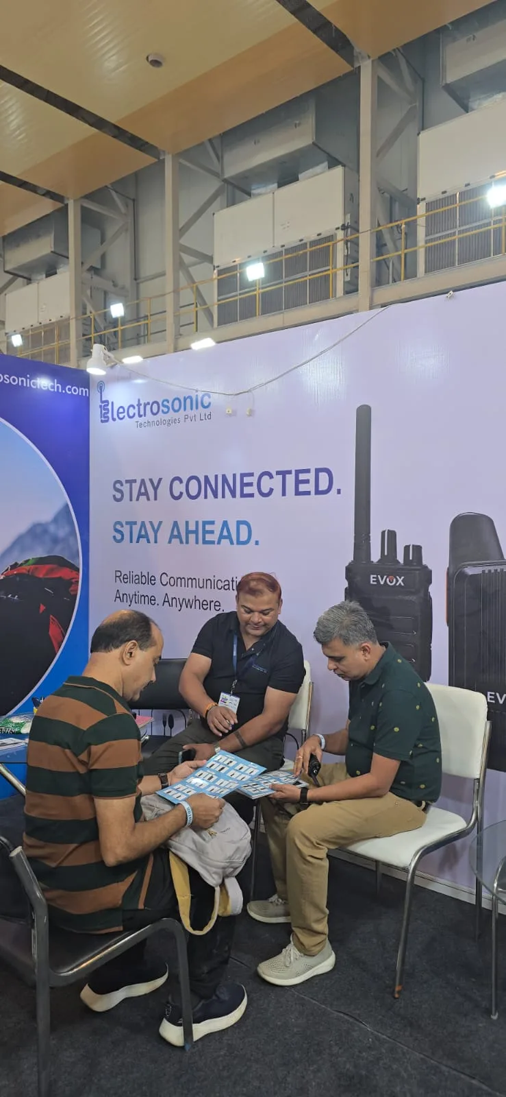 Electrosonic team meeting exhibition visitors for communication system consultation