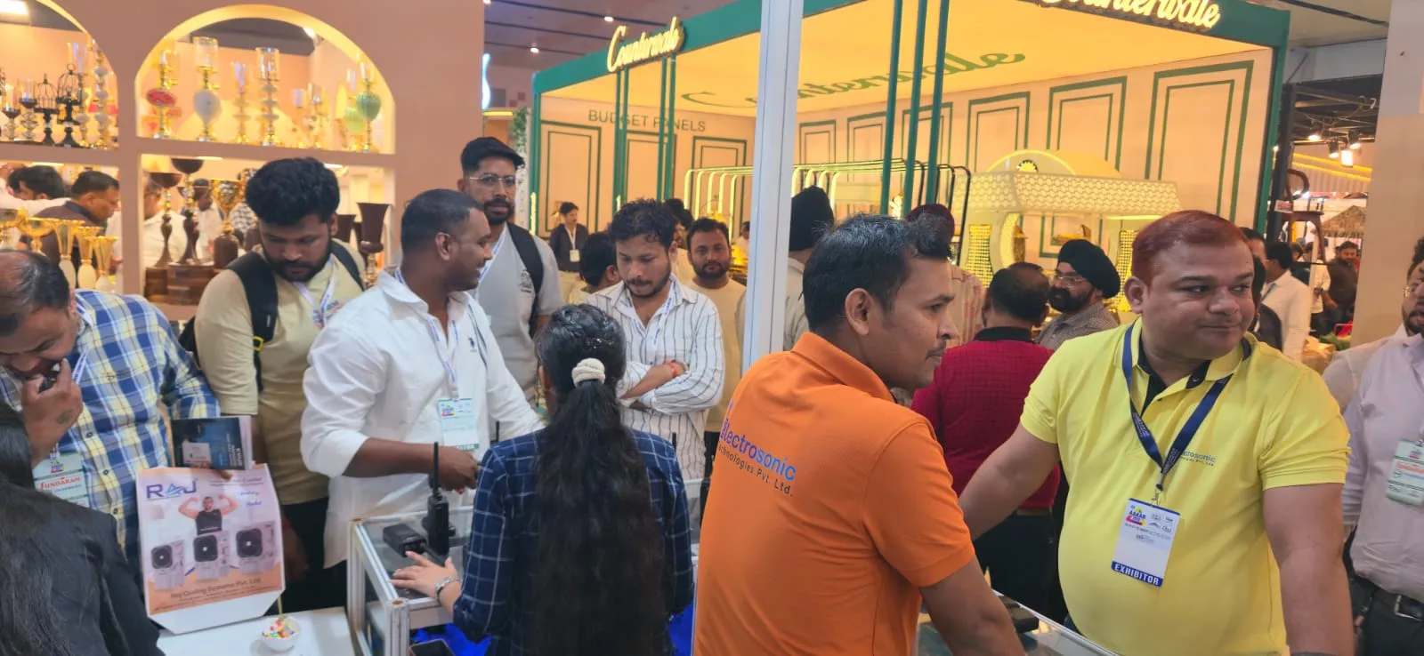 Visitors at the Electrosonic Technologies stall reviewing professional communication radios