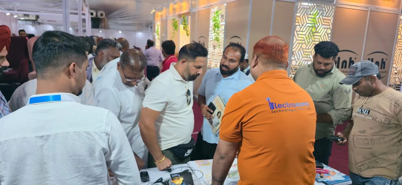 Busy visitor interaction around the Electrosonic booth at HMTEX Expo Ludhiana
