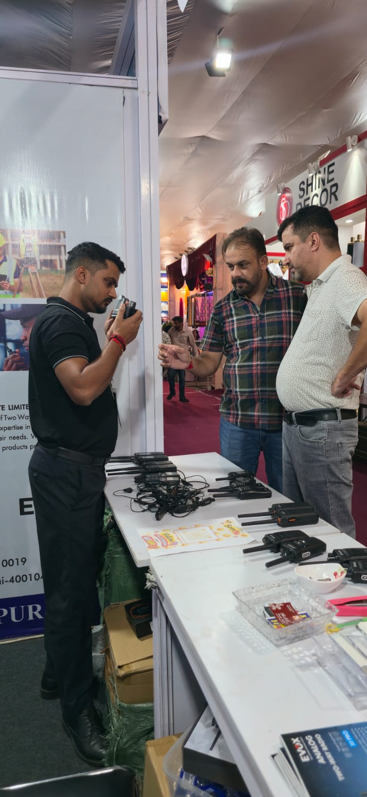 Electrosonic team demonstrating a radio to HMTEX visitors